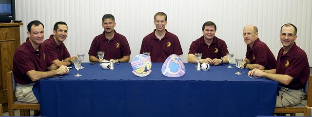 KENNEDY SPACE CENTER, FLA. - On the second launch attempt, the STS-113 crew enjoys a snack before suiting up for launch. The launch was scrubbed on Nov. 22 because of poor weather in the Transoceanic Abort Landing sites. Seated left to right are Mission Specialists Michael Lopez-Alegria and John Herrington, Pilot Paul Lockhart and Commander James Wetherbee; Expedition 6 flight engineer Nikolai Budarin, Commander Ken Bowersox and flight engineer Donald Pettit. STS-113 is the 16th American assembly flight to the International Space Station. The launch will carry the Expedition 6 crew to the Station and return the Expedition 5 crew to Earth. The major objective of the mission is delivery of the Port 1 (P1) Integrated Truss Assembly, which will be attached to the port side of the S0 truss. Three spacewalks are planned to install and activate the truss and its associated equipment. Launch of Space Shuttle Endeavour on mission STS-113 is now scheduled for Nov. 23 at 7:50 p.m. EST.