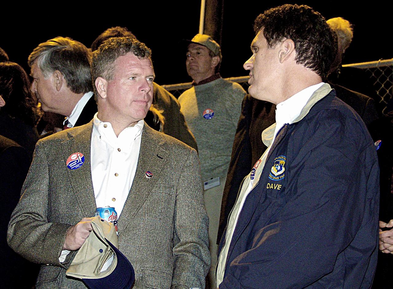 KENNEDY SPACE CENTER, FLA. - U.S. Congressmen from Florida Tom Feeney (left) and Dave Weldon wait in the VIP viewing site for the STS-113 launch. The launch will carry the Expedition 6 crew to the Station and return the Expedition 5 crew to Earth. The major objective of the mission is delivery of the Port 1 (P1) Integrated Truss Assembly, which will be attached to the port side of the S0 truss. Three spacewalks are planned to install and activate the truss and its associated equipment. Launch of Space Shuttle Endeavour on mission STS-113 is now scheduled for Nov. 23 at 7:50 p.m. EST.