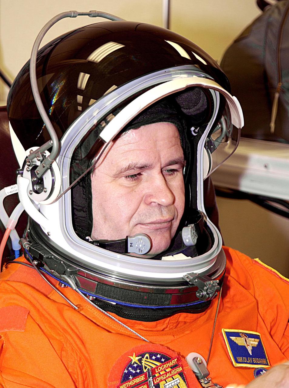 KENNEDY SPACE CENTER, FLA. -- Expedition 6 flight engineer Nikolai Budarin is stoic as he suits up for a second launch attempt on mission STS-113. The launch on Nov. 22 was scrubbed due to poor weather conditions at the Transoceanic Abort Landing sites.  Budarin, who is with the Russian Space Agency,  will be making his second Shuttle flight. The primary mission for the crew is bringing the Expedition 6 crew to the Station and returning the Expedition 5 crew to Earth.  The major objective of the mission is delivery of the Port 1 (P1) Integrated Truss Assembly, which will be attached to the port side of the S0 truss.  Three spacewalks are planned to install and activate the truss and its associated equipment.  Launch of Space Shuttle Endeavour on mission STS-113 is scheduled for 7:50 p.m. EST.    