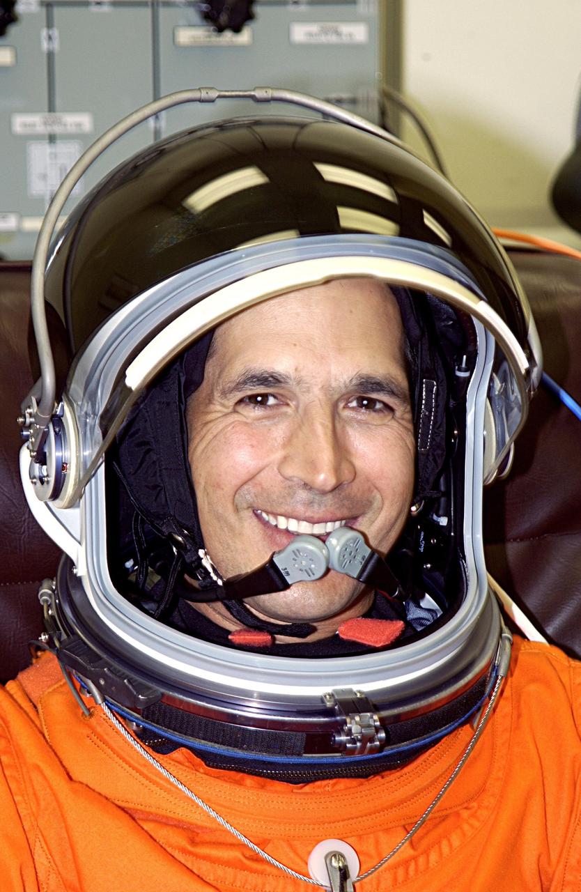 KENNEDY SPACE CENTER, FLA. -- - STS-113 Mission Specialist John Herrington smiles as he finishes suiting up for a second launch attempt on mission STS-113. The launch on Nov. 22 was scrubbed due to poor weather conditions at the Transoceanic Abort Landing sites. Herrington will be making his first Shuttle flight. The launch will carry the Expedition 6 crew to the Station and return the Expedition 5 crew to Earth. The major objective of the mission is delivery of the Port 1 (P1) Integrated Truss Assembly, which will be attached to the port side of the S0 truss. Three spacewalks are planned to install and activate the truss and its associated equipment. Launch of Space Shuttle Endeavour on mission STS-113 is now scheduled for Nov. 23 at 7:50 p.m. EST.