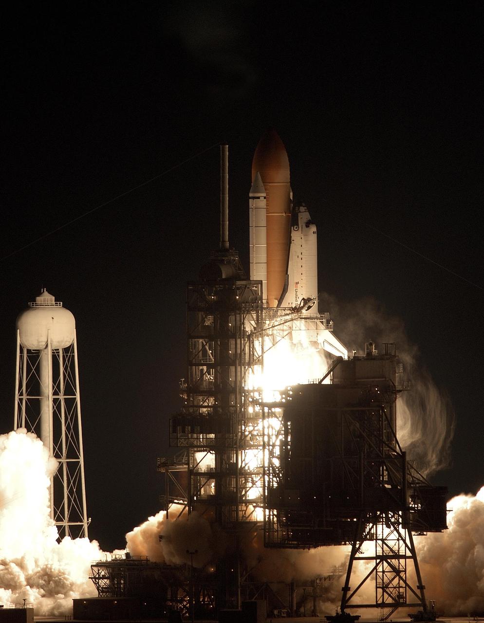 KENNEDY SPACE CENTER, FLA. --  Against a black moonless sky, Space Shuttle Endeavour blazes into space after an ontime liftoff at 7:49:47 p.m. EST.  The launch is the 19th for Endeavour, and the 112th flight in the Shuttle program.  Mission STS-113 is the 16th assembly flight to the International Space Station, carrying another structure for the Station, the P1 integrated truss.  Also onboard are the Expedition 6 crew, who will replace Expedition 5.  Endeavour is scheduled to land at KSC after an 11-day journey.  [Photo by Ray Yost]            