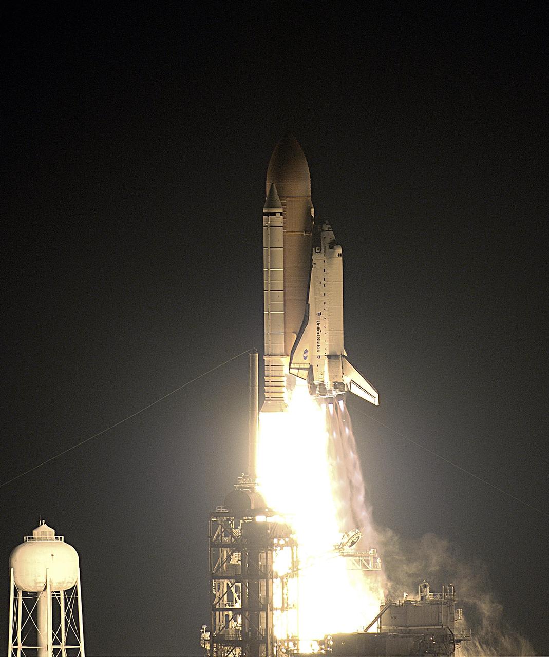 KENNEDY SPACE CENTER, FLA. - Against a black moonless sky, Space Shuttle Endeavour lights up the night as it blazes into space after an ontime liftoff at 7:49:47 p.m. EST.  The launch is the 19th for Endeavour, and the 112th flight in the Shuttle program.  Mission STS-113 is the 16th assembly flight to the International Space Station, carrying another structure for the Station, the P1 integrated truss.  Also onboard are the Expedition 6 crew, who will replace Expedition 5.  Endeavour is scheduled to land at KSC after an 11-day journey.  [Photo by Scott Andrews]            