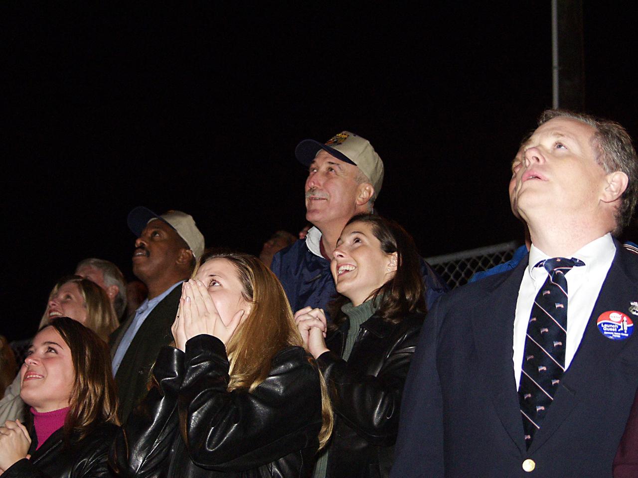KENNEDY SPACE CENTER, FLA. - Among the visitors watching the launch of Space Shuttle Endeavour on mission STS-113 are NASA Administrator Sean O'Keefe (top, center) and Glen Mahone, associate administrator for public affairs, NASA (left of O'Keefe). Liftoff occurred ontime at 7:49:47 p.m. EST. The launch is the 19th for Endeavour, and the 112th flight in the Shuttle program. Mission STS-113 is the 16th assembly flight to the International Space Station, carrying another structure for the Station, the P1 integrated truss. Also onboard are the Expedition 6 crew, who will replace Expedition 5. Endeavour is scheduled to land at KSC after an 11-day journey.