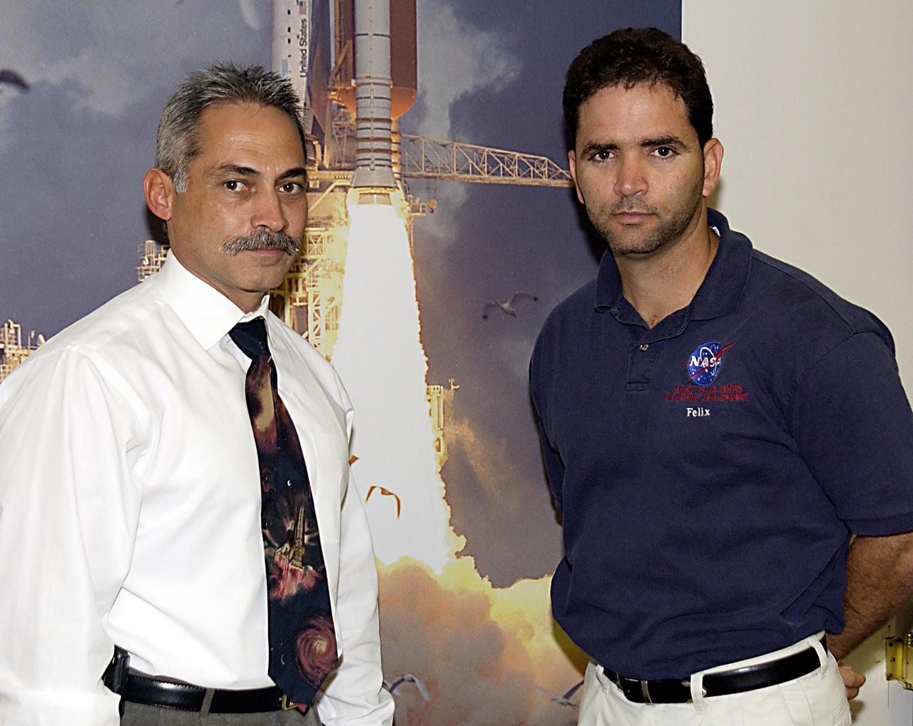 KENNEDY SPACE CENTER, FLA. -- Cryogenic Propulsion Branch Chief Henry Bursian (left) and Project Manager Felix Alberto SotoToro, Ph.D. discuss future business plans.            