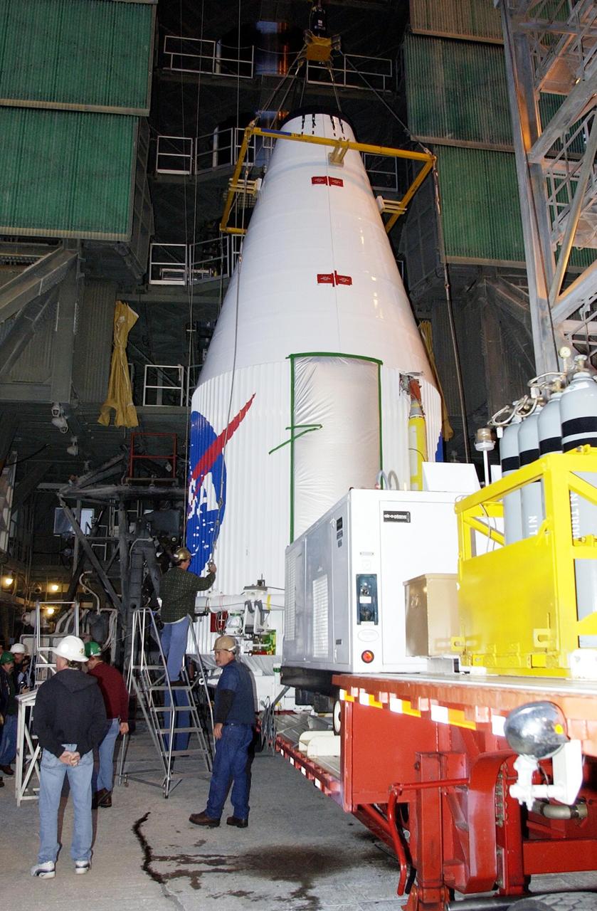 KENNEDY SPACE CENTER, FLA. - The TDRS-J satellite arrives at the gantry on Launch Complex 36-A, Cape Canaveral Air Force Station.  The satellite is scheduled to be launched Dec. 4 aboard an Atlas IIA vehicle.  The launch window is 9:42 to 10:22 p.m. EST. TDRS-J, the third in a series of telemetry satellites, will help replenish the current constellation of geosynchronous TDRS satellites that are the primary source of space-to-ground voice, data and telemetry for the Space Shuttle. The satellites also provide communications with the International Space Station and scientific spacecraft in low-Earth orbit such as the Hubble Space Telescope. This new advanced series of satellites will extend the availability of TDRS communications services until about 2017.