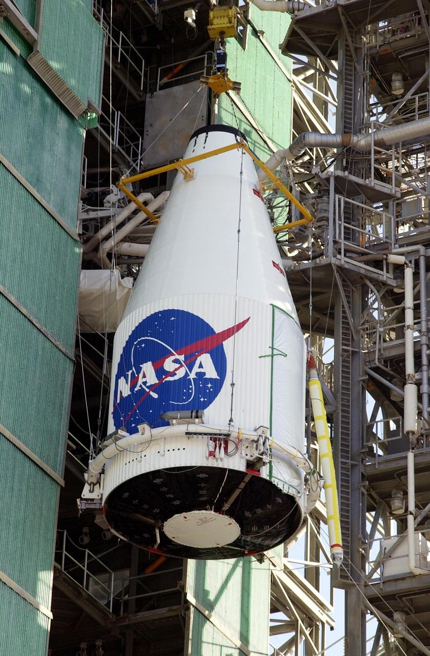 KENNEDY SPACE CENTER, FLA. -- The TDRS-J satellite is lifted up the gantry on Launch Complex 36-A, Cape Canaveral Air Force Station.  The satellite is scheduled to be launched Dec. 4 aboard an Atlas IIA vehicle.  The launch window is 9:42 to 10:22 p.m. EST. TDRS-J, the third in a series of telemetry satellites, will help replenish the current constellation of geosynchronous TDRS satellites that are the primary source of space-to-ground voice, data and telemetry for the Space Shuttle. The satellites also provide communications with the International Space Station and scientific spacecraft in low-Earth orbit such as the Hubble Space Telescope. This new advanced series of satellites will extend the availability of TDRS communications services until about 2017.  