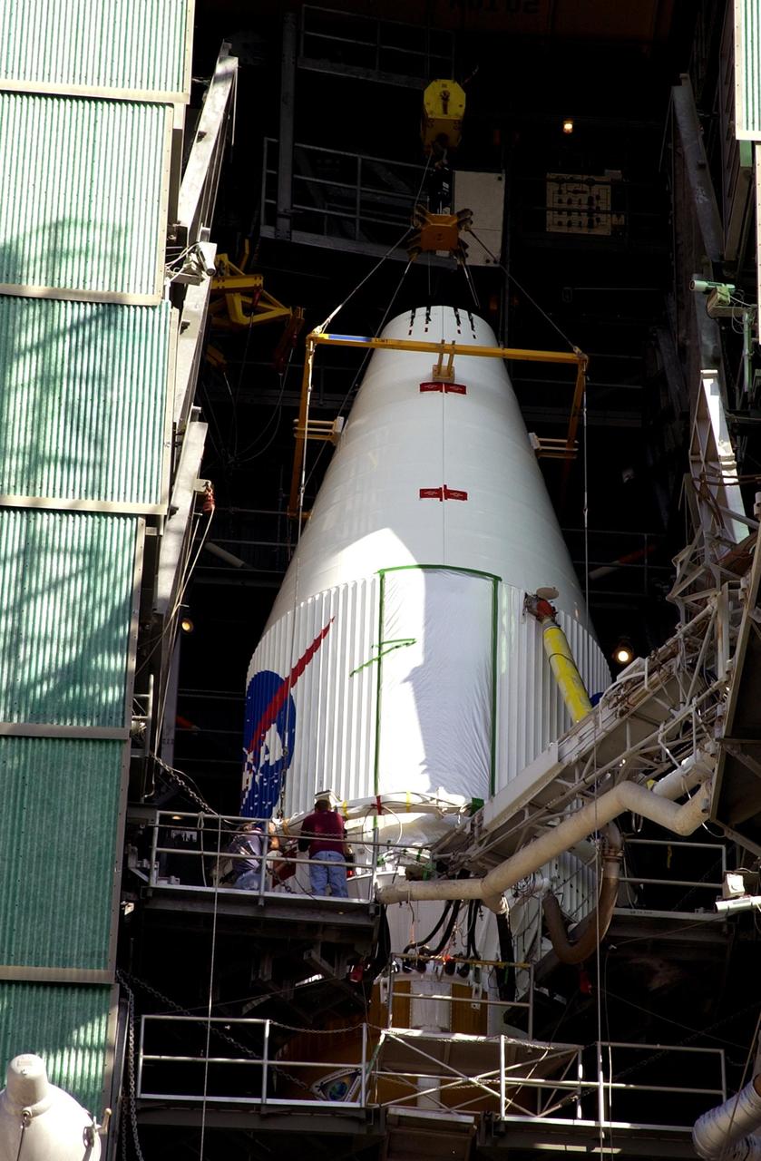 KENNEDY SPACE CENTER, FLA. -- The encapsulated TDRS-J satellite is mated with the Atlas IIA launch vehicle on Launch Complex 36-A, Cape Canaveral Air Force Station.  The satellite is scheduled to be launched Dec. 4 aboard an Atlas IIA vehicle.  The launch window is 9:42 to 10:22 p.m. EST. TDRS-J, the third in a series of telemetry satellites, will help replenish the current constellation of geosynchronous TDRS satellites that are the primary source of space-to-ground voice, data and telemetry for the Space Shuttle. The satellites also provide communications with the International Space Station and scientific spacecraft in low-Earth orbit such as the Hubble Space Telescope. This new advanced series of satellites will extend the availability of TDRS communications services until about 2017.  