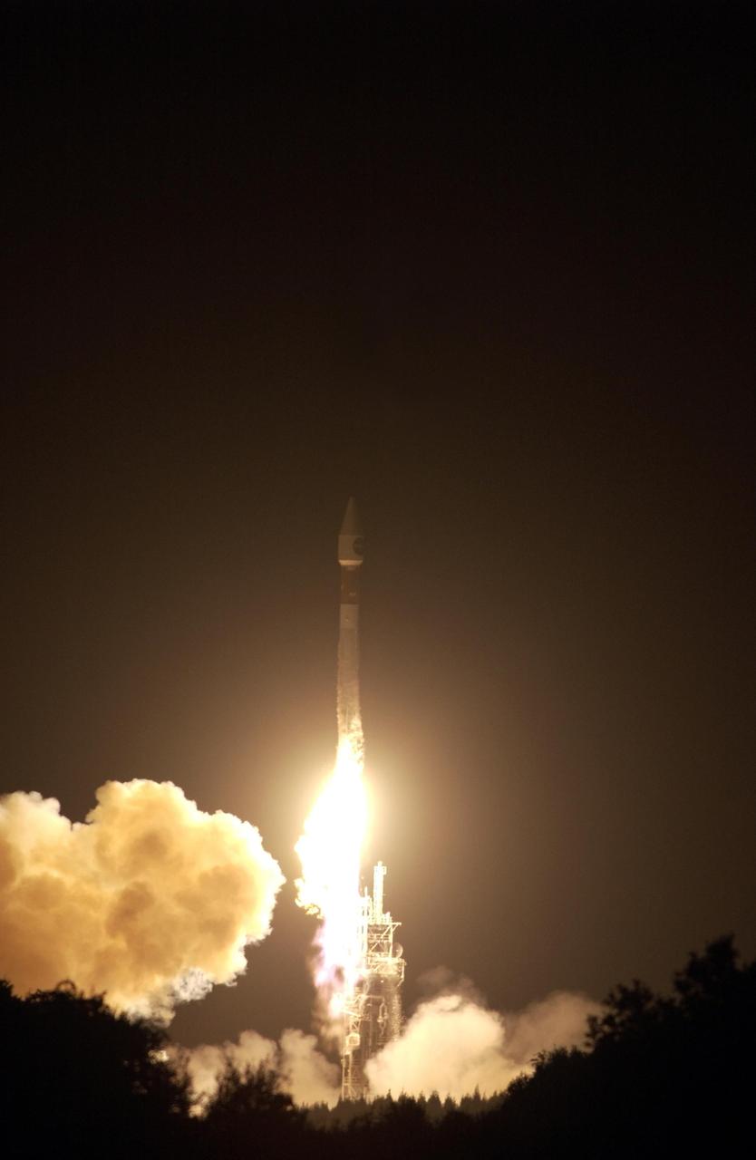 KENNEDY SPACE CENTER, FLA. - At Launch Complex 36-A, Cape Canaveral Air Force Station, the TDRS-J satellite launches aboard an Atlas IIA vehicle on Dec. 4 at the beginning of the launch window at 9:42 p.m. EST. TDRS-J, the third in a series of telemetry satellites, will help replenish the current constellation of geosynchronous TDRS satellites that are the primary source of space-to-ground voice, data and telemetry for the Space Shuttle. The satellites also provide communications with the International Space Station and scientific spacecraft in low-Earth orbit such as the Hubble Space Telescope. This new advanced series of satellites will extend the availability of TDRS communications services until about 2017.