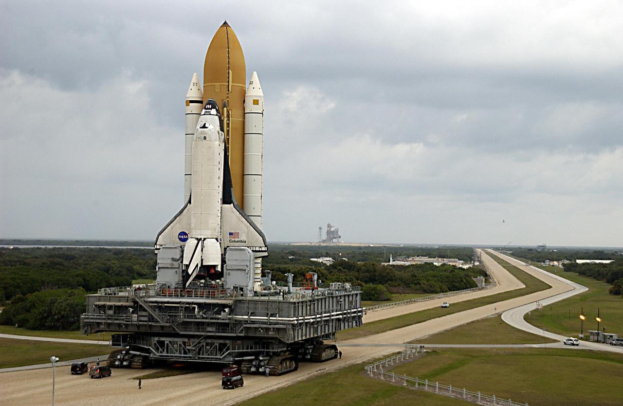 KENNEDY SPACE CENTER, FLA. -- Space Shuttle Columbia rolls towards Launch Pad 39A, sitting atop the Mobile Launcher Platform, which in turn is carried by the crawler-transporter underneath. The STS-107 research mission comprises experiments ranging from material sciences to life sciences (many rats), plus the Fast Reaction Experiments Enabling Science, Technology, Applications and Research (FREESTAR) that incorporates eight high priority secondary attached shuttle experiments. Mission STS-107 is scheduled to launch Jan. 16, 2003.  