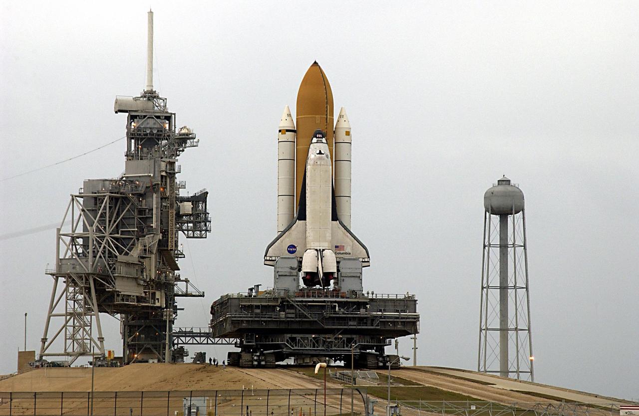 KENNEDY SPACE CENTER, FLA. -- Space Shuttle Columbia, atop the Mobile Launcher Platform, approaches the top of Launch Pad 39A where it will undergo preparations for launch. The STS-107 research mission comprises experiments ranging from material sciences to life sciences, plus the Fast Reaction Experiments Enabling Science, Technology, Applications and Research (FREESTAR) that incorporates eight high priority secondary attached shuttle experiments. Mission STS-107 is scheduled to launch Jan. 16, 2003.      