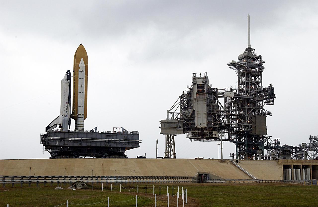 KENNEDY SPACE CENTER, FLA. -- Space Shuttle Columbia approaches Launch Pad 39A, sitting atop the Mobile Launcher Platform, which in turn is carried by the crawler-transporter underneath. The STS-107 research mission comprises experiments ranging from material sciences to life sciences (many rats), plus the Fast Reaction Experiments Enabling Science, Technology, Applications and Research (FREESTAR) that incorporates eight high priority secondary attached shuttle experiments. Mission STS-107 is scheduled to launch Jan. 16, 2003.    