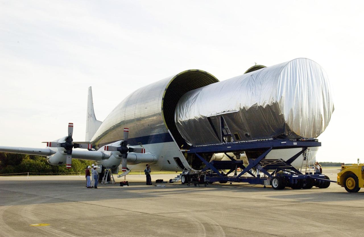 KENNEDY SPACE CENTER, FLA. -- The Integrated Equipment Assembly (IEA), one of two major components of the Starboard 6 (S6) truss segment for the International Space Station (ISS), is offloaded from NASA's Super Guppy cargo airplane following its arrival at the Shuttle Landing Facility. The customized four-engine aricraft has a 24-foot-diameter fuselage and a foldaway nose enabling it to load and transport oversize cargo. The IEA will be joined to its companion piece, the Long Spacer, before launch early in 2004. The S6 truss segment will be the 11th and final piece of the Station's Integrated Truss Structure and will support the fourth and final set of solar arrays, batteries, and electronics.