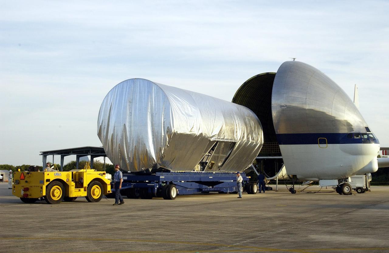 KENNEDY SPACE CENTER, FLA. -- The Integrated Equipment Assembly (IEA), one of two major components of the Starboard 6 (S6) truss segment for the International Space Station (ISS), is offloaded from NASA's Super Guppy cargo airplane following its arrival at the Shuttle Landing Facility. The customized four-engine aricraft has a 24-foot-diameter fuselage and a foldaway nose enabling it to load and transport oversize cargo. The IEA will be joined to its companion piece, the Long Spacer, before launch early in 2004. The S6 truss segment will be the 11th and final piece of the Station's Integrated Truss Structure and will support the fourth and final set of solar arrays, batteries, and electronics.