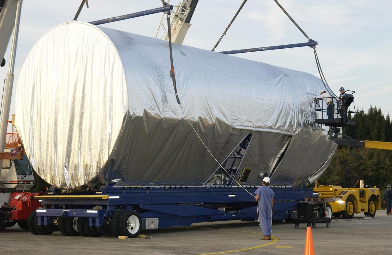 KENNEDY SPACE CENTER, FLA. -- The Integrated Equipment Assembly (IEA), one of two major components of the Starboard 6 (S6) truss segment for the International Space Station (ISS), is offloaded onto a cargo transporter following its arrival at the Shuttle Landing Facility. The IEA will be joined to its companion piece, the Long Spacer, before launch early in 2004.  The S6 truss segment will be the 11th and final piece of the Station's Integrated Truss Structure and will support the fourth and final set of solar arrays, batteries, and electronics. 