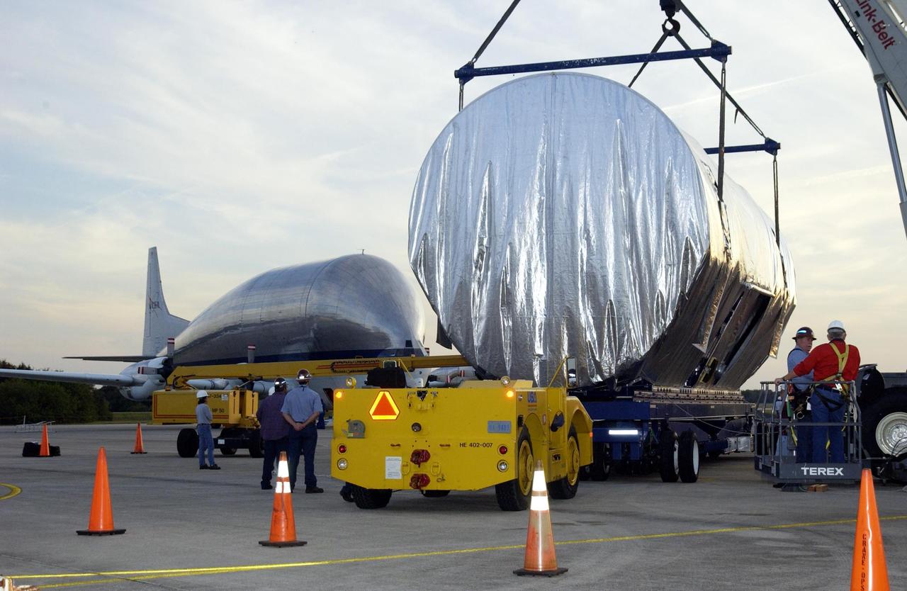 KENNEDY SPACE CENTER, FLA. -- The Integrated Equipment Assembly (IEA), one of two major components of the Starboard 6 (S6) truss segment for the International Space Station (ISS), is offloaded onto a cargo transporter following its arrival at the Shuttle Landing Facility. The IEA will be joined to its companion piece, the Long Spacer, before launch early in 2004.  The S6 truss segment will be the 11th and final piece of the Station's Integrated Truss Structure and will support the fourth and final set of solar arrays, batteries, and electronics. 