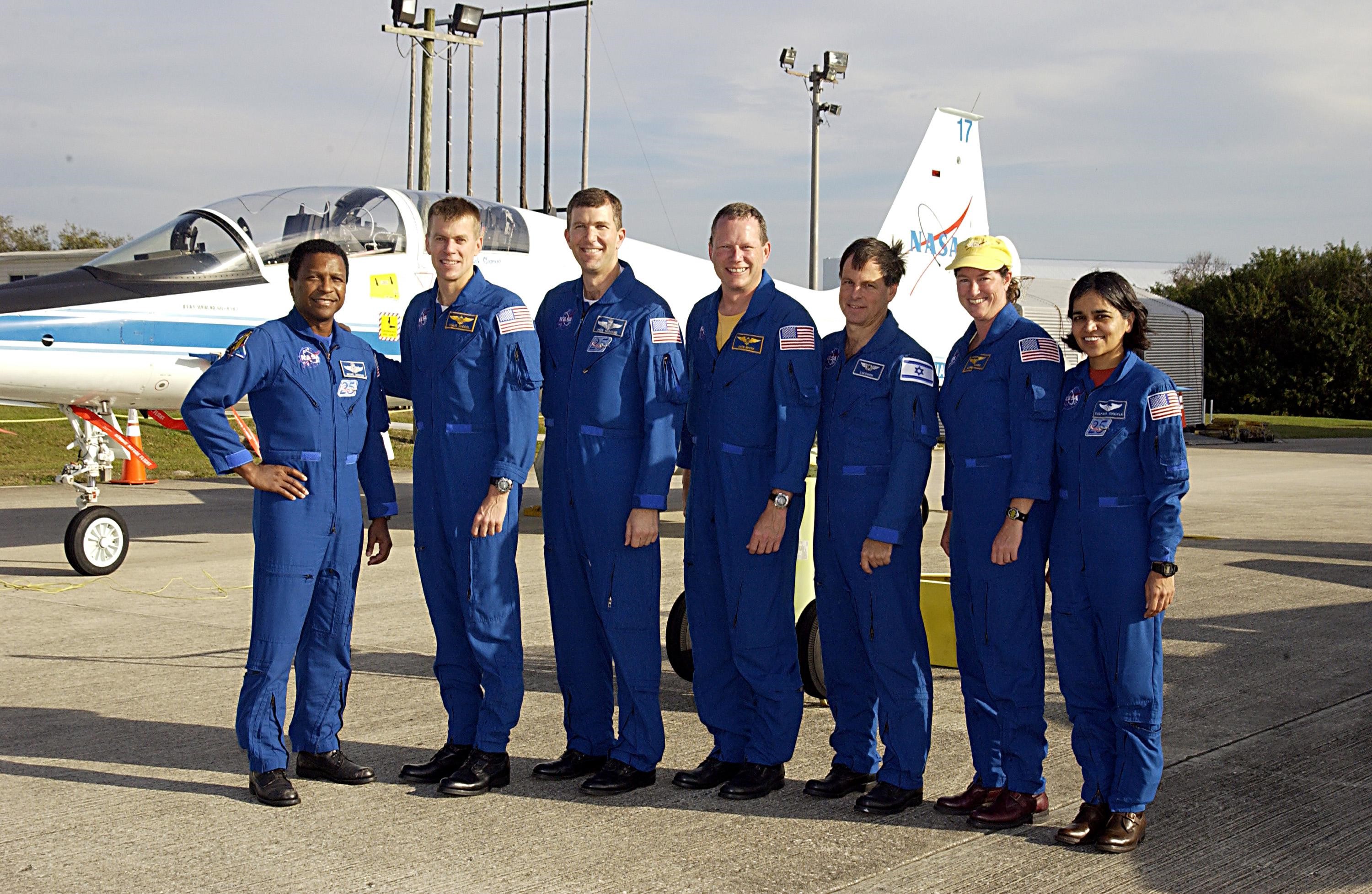 KENNEDY SPACE CENTER, FLA. --  The STS-107 crew arrives at KSC to take part in Terminal Countdown Demonstration Test activities.   Standing, left to right, are Payload Commander Michael Anderson, Pilot William "Willie" McCool, Commander Rick Husband, Mission Specialist David Brown, Payload Specialist Ilan Ramon (the first Israeli astronaut), and Mission Specialists Laurel Clark and Kalpana Chawla.  STS-107 is a mission devoted to research and will include more than 80 experiments that will study Earth and space science, advanced technology development, and astronaut health and safety.  