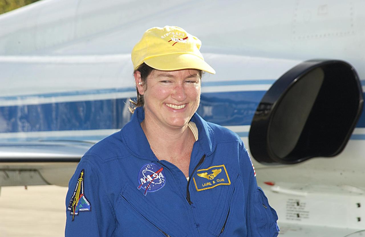 KENNEDY SPACE CENTER, FLA. --  STS-107 Mission Specialist Laurel Clark arrives at KSC to take part in Terminal Countdown Demonstration Test activities, which include a simulated launch countdown.   Other crew members are Commander Rick Husband, Pilot William "Willie" McCool, Payload Commander Michael Anderson, Mission Specialists Kalpana Chawla and David Brown, and Payload Specialist Ilan Ramon, the first Israeli astronaut.  STS-107 is a mission devoted to research and will include more than 80 experiments that will study Earth and space science, advanced technology development, and astronaut health and safety.  Launch is scheduled for Jan. 16, 2003.