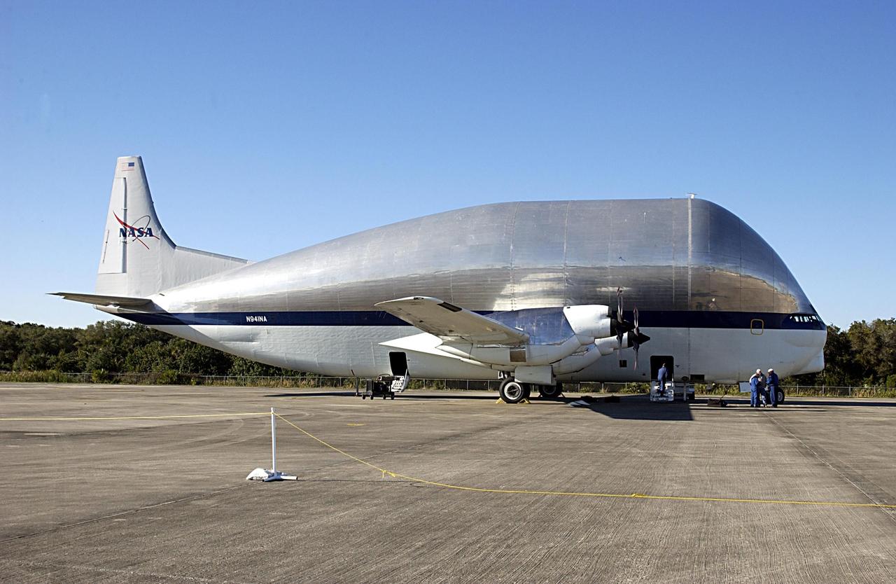 KENNEDY SPACE CENTER, FLA. - NASA's Super Guppy cargo airplane parks on the Shuttle Landing Facility at KSC before offloading the Long Spacer (LS), the second and final piece of the Starboard 6 (S6) Integrated Truss Segment. The LS will be transported to the Space Station Processing Facility for inspections and verification tests. Eventually the LS will be integrated with the S6 Integrated Equipment Assembly already at KSC and will fly as one segment to the International Space Station on Space Shuttle mission STS-119 in early 2004. Together the segment pieces weigh 26,000 pounds and measure 45 feet long. .