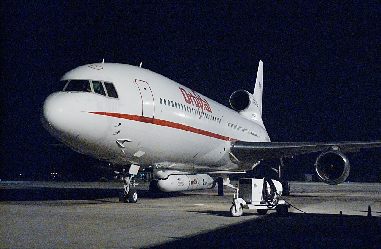 KENNEDY SPACE CENTER, FLA. - An Orbital Sciences L-1011 aircraft arrives at the Cape Canaveral Air Force Station Skid Strip. Attached underneath the aircraft is the Pegasus XL Expendable Launch Vehicle, which will be transported to the Multi-Payload Processing Facility for testing and verification. The Pegasus will undergo three flight simulations prior to its scheduled launch in late January 2003. The Pegasus XL will carry NASA's Solar Radiation and Climate Experiment (SORCE) into orbit. Built by Orbital Sciences Space Systems Group, SORCE will study and measure solar irradiance as a source of energy in the Earth's atmosphere. .