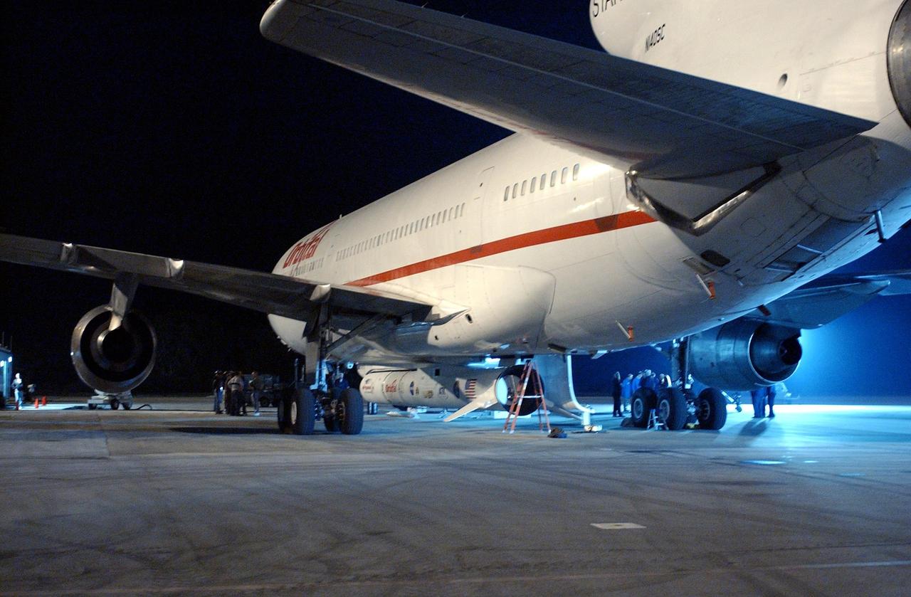 KENNEDY SPACE CENTER, FLA. -- Attached underneath the Orbital Sciences L-1011 aircraft is the Pegasus XL Expendable Launch Vehicle, which will be transported to the Multi-Payload Processing Facility for testing and verification. The Pegasus will undergo three flight simulations prior to its scheduled launch in late January 2003. The Pegasus XL will carry NASA's Solar Radiation and Climate Experiment (SORCE) into orbit. Built by Orbital Sciences Space Systems Group, SORCE will study and measure solar irradiance as a source of energy in the Earth's atmosphere. .