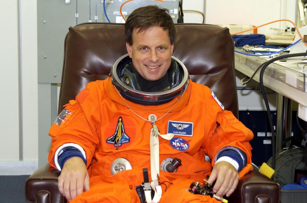 KENNEDY SPACE CENTER, FLA. - STS-107 Payload Specialist Ilan Ramon, the first Israeli astronaut, sits happily during suitup for Terminal Countdown Demonstration Test activities, which include a simulated launch countdown at the pad. STS-107 is a mission devoted to research and will include more than 80 experiments that will study Earth and space science, advanced technology development, and astronaut health and safety. Launch is planned for Jan. 16, 2003, between 10 a.m. and 2 p.m. EST aboard Space Shuttle Columbia. .