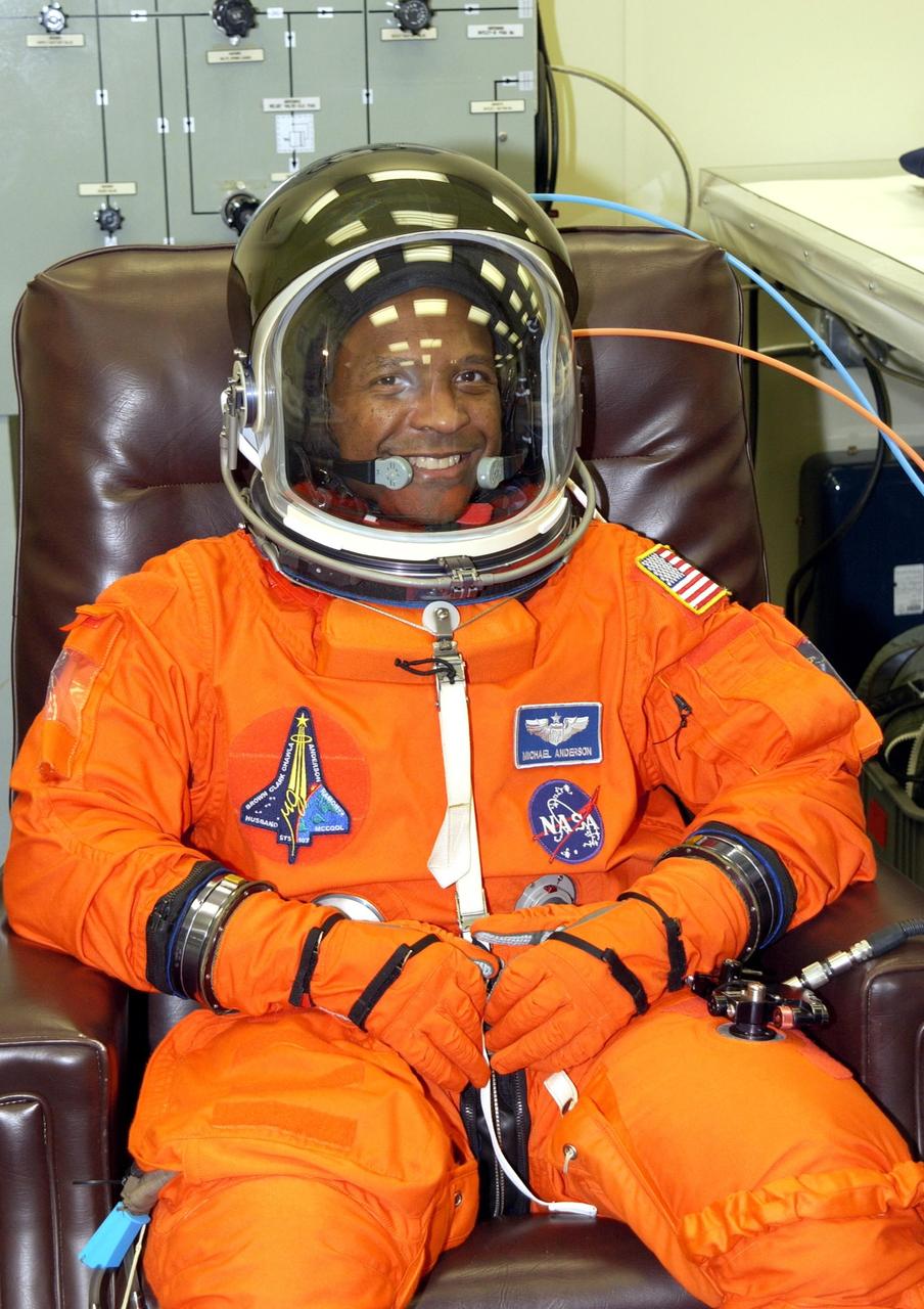 KENNEDY SPACE CENTER, FLA. -- STS-107 Payload Commander Michael Anderson completes suit check prior to Terminal Countdown Demonstration Test activities, which include a simulated launch countdown at the pad. STS-107 is a mission devoted to research and will include more than 80 experiments that will study Earth and space science, advanced technology development, and astronaut health and safety. Launch is planned for Jan. 16, 2003, between 10 a.m. and 2 p.m. EST aboard Space Shuttle Columbia. .