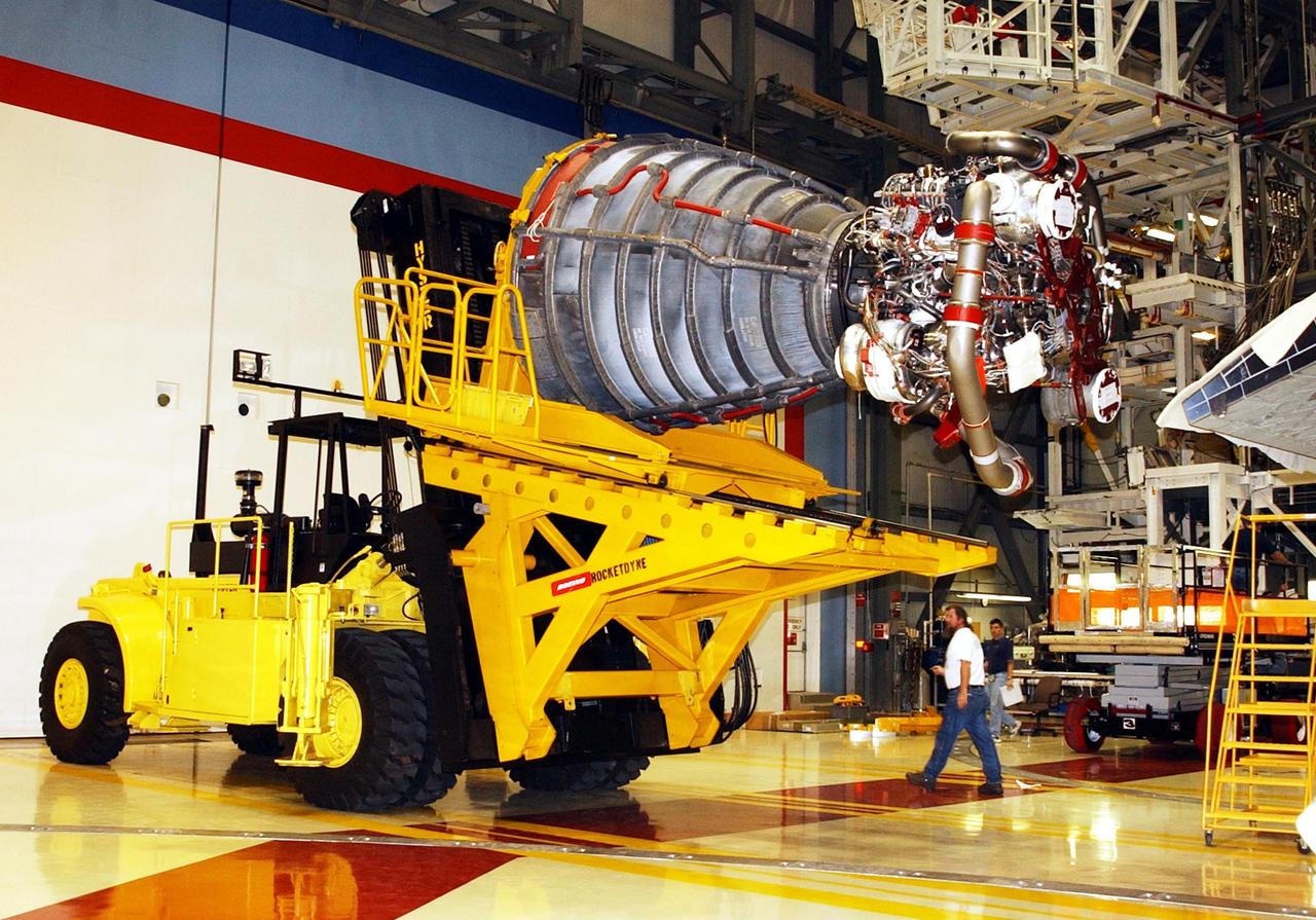 KENNEDY SPACE CENTER, FLA. - In the Orbiter Processing Facility, an orbiter main engine is secured on the new engine hyster, built by Rocketdyne, used to remove it from the orbiter. .
