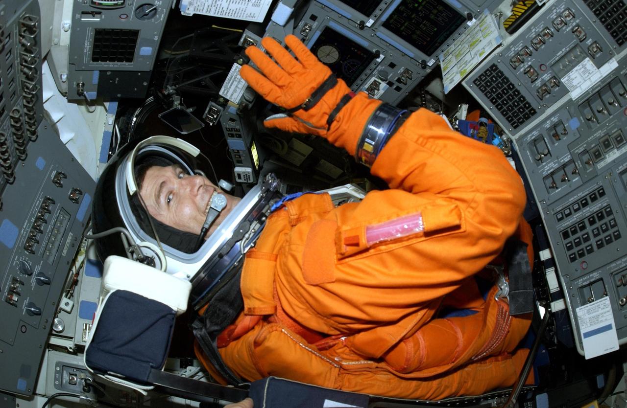 KENNEDY SPACE CENTER, FLA. - STS-107 Commander Rick Husband sits in the cockpit of Space Shuttle Columbia during a simulated launch countdown, part of Terminal Countdown Demonstration Test activities. STS-107 is a mission devoted to research and will include more than 80 experiments that will study Earth and space science, advanced technology development, and astronaut health and safety. Launch is planned for Jan. 16, 2003, between 10 a.m. and 2 p.m. EST aboard Space Shuttle Columbia.        .  