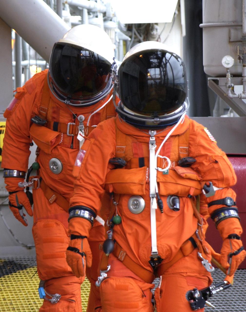 KENNEDY SPACE CENTER, FLA. - The STS-107 crew practice emergency egress from the launch pad during a simulated launch countdown, part of Terminal Countdown Demonstration Test activities. STS-107 is a mission devoted to research and will include more than 80 experiments that will study Earth and space science, advanced technology development, and astronaut health and safety. Launch is planned for Jan. 16, 2003, between 10 a.m. and 2 p.m. EST aboard Space Shuttle Columbia.        .  
