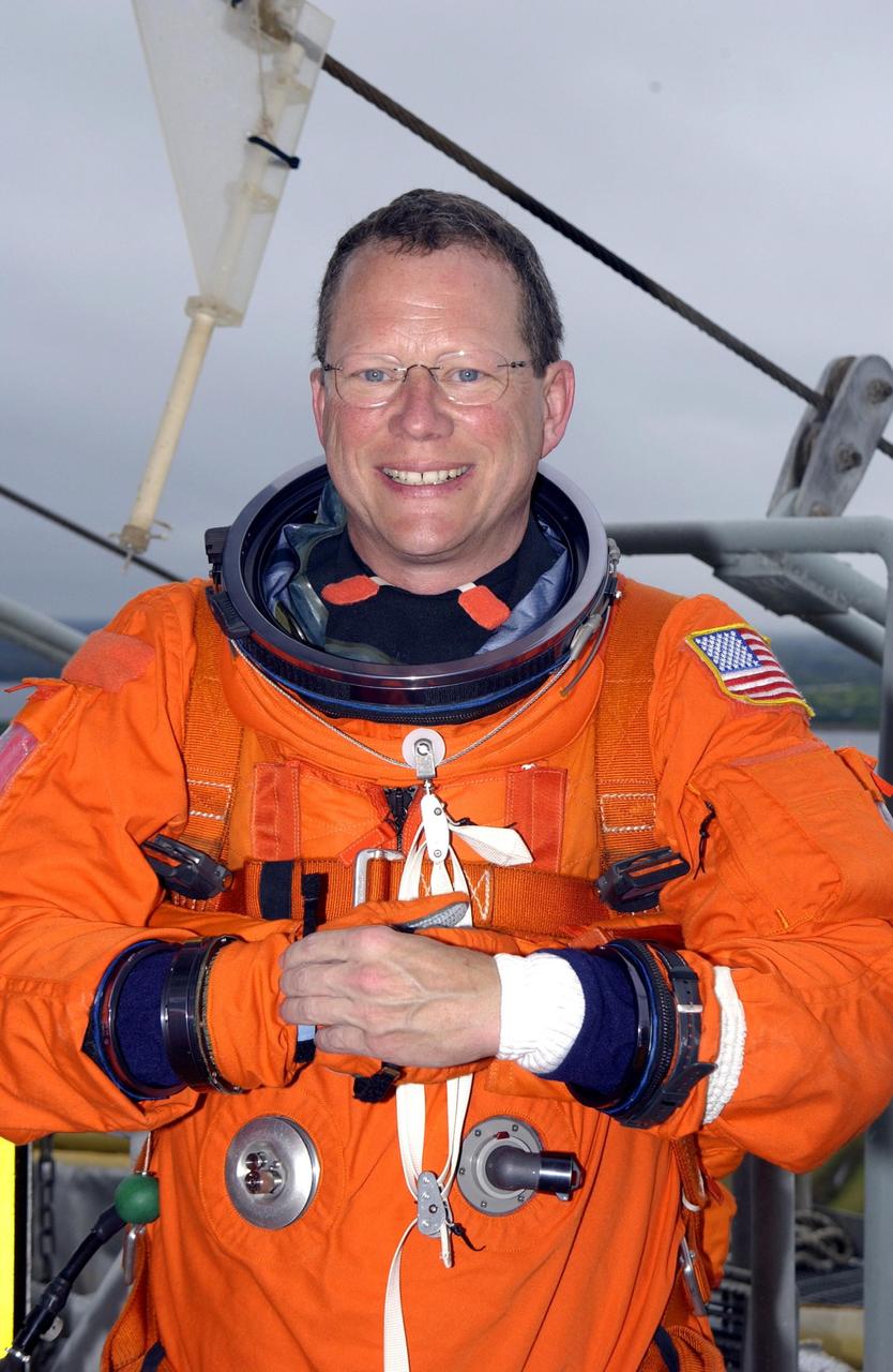 KENNEDY SPACE CENTER, FLA. -- Sitting in the slidewire basket on the launch pad is Mission Specialist David Brown.  The crew is taking part in a simulated launch countdown, part of Terminal Countdown Demonstration Test activities.   STS-107 is a mission devoted to research and will include more than 80 experiments that will study Earth and space science, advanced technology development, and astronaut health and safety. Launch is planned for Jan. 16, 2003, between 10 a.m. and 2 p.m. EST aboard Space Shuttle Columbia.        .  