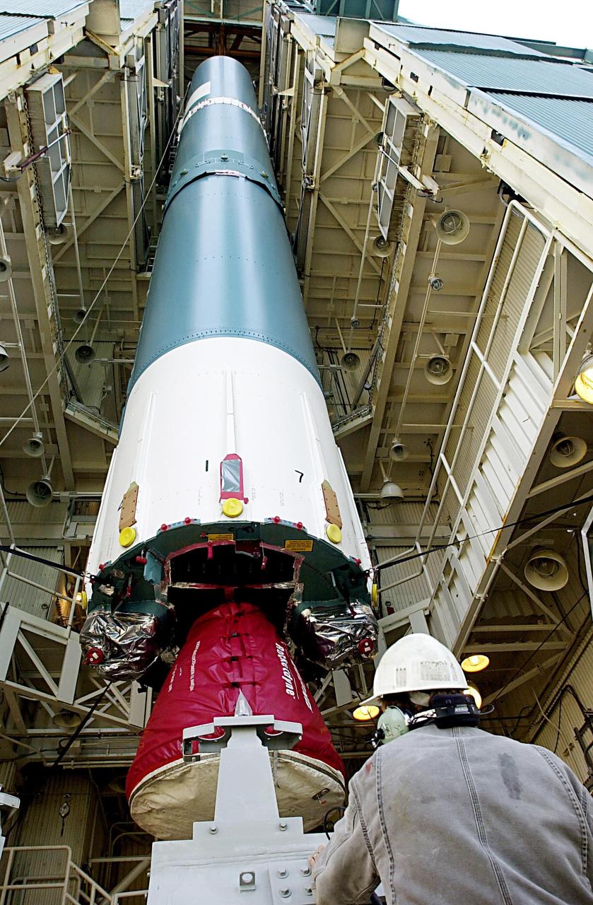 KENNEDY SPACE CENTER, FLA. - The first stage of the Delta II rocket is moved into place in the tower on NASA's Space Launch Complex 2 (SLC-2), Vandenberg Air Force Base, Calif. The rocket will carry the ICESat and CHIPSat satellites into Earth orbits. ICESat is a 661-pound satellite known as Geoscience Laser Altimeter System (GLAS) that will revolutionize our understanding of ice and its role in global climate change and how we protect and understand our home planet. It will help scientists determine if the global sea level is rising or falling. It will look at the ice sheets that blanket the Earth's poles to see if they are growing or shrinking. It will assist in developing an understanding of how changes in the Earth's atmosphere and climate effect polar ice masses and global sea level. CHIPSat, a suitcase-size 131-pound satellite, will provide invaluable information into the origin, physical processes and properties of the hot gas contained in the interstellar medium. This can provide important clues about the formation and evolution of galaxies since the interstellar medium literally contains the seeds of future stars. The Delta II launch is scheduled for Jan. 11 between 4:45 p.m. - 5:30 p.m. PST.