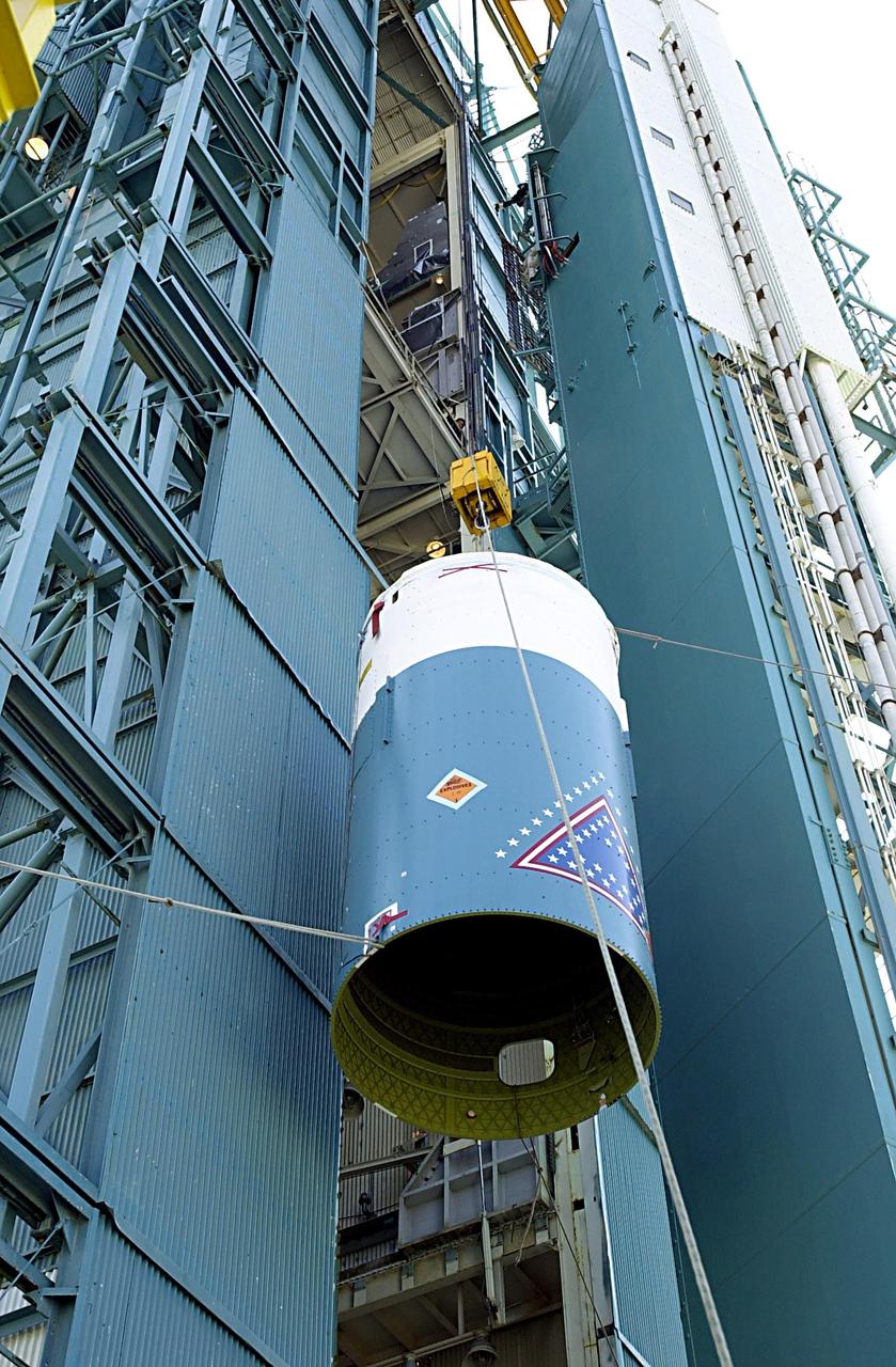 KENNEDY SPACE CENTER, FLA. - The interstage of the Delta II rocket is lifted up the launch tower on NASA's Space Launch Complex 2 (SLC-2), Vandenberg Air Force Base, Calif. The interstage will eventually house the second stage and will be mated with the first stage. The rocket will carry the ICESat and CHIPSat satellites into Earth orbits. ICESat is a 661-pound satellite known as Geoscience Laser Altimeter System (GLAS) that will revolutionize our understanding of ice and its role in global climate change and how we protect and understand our home planet. It will help scientists determine if the global sea level is rising or falling. It will look at the ice sheets that blanket the Earth's poles to see if they are growing or shrinking. It will assist in developing an understanding of how changes in the Earth's atmosphere and climate effect polar ice masses and global sea level. CHIPSat, a suitcase-size 131-pound satellite, will provide invaluable information into the origin, physical processes and properties of the hot gas contained in the interstellar medium. This can provide important clues about the formation and evolution of galaxies since the interstellar medium literally contains the seeds of future stars. The Delta II launch is scheduled for Jan. 11 between 4:45 p.m. - 5:30 p.m. PST.