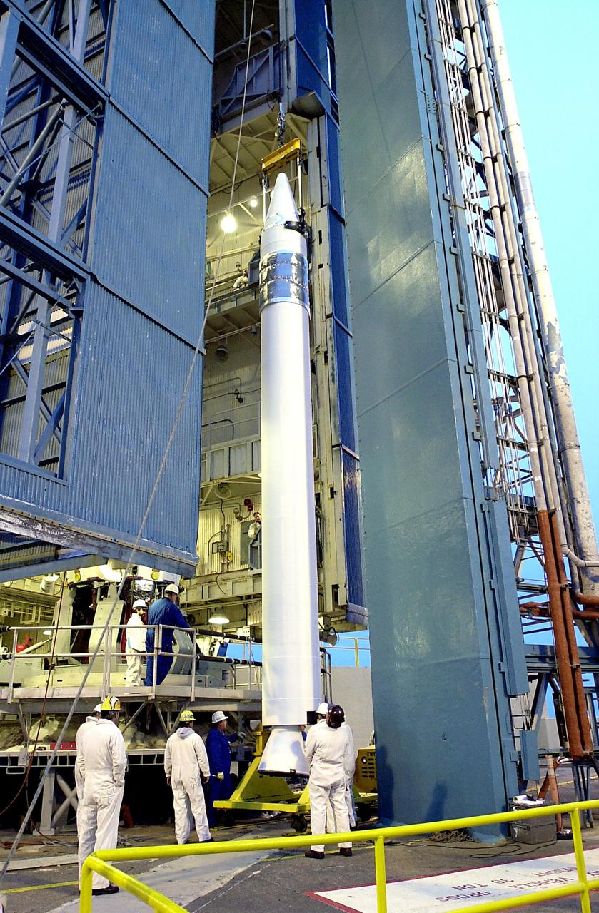 KENNEDY SPACE CENTER, FLA. - On the launch tower on NASA's Space Launch Complex 2 (SLC-2), Vandenberg Air Force Base, Calif., a solid rocket booster is lifted into an upright position as preparations continue to mate it to a Delta II rocket. The rocket will carry the ICESat and CHIPSat satellites into Earth orbits. ICESat is a 661-pound satellite known as Geoscience Laser Altimeter System (GLAS) that will revolutionize our understanding of ice and its role in global climate change and how we protect and understand our home planet. It will help scientists determine if the global sea level is rising or falling. It will look at the ice sheets that blanket the Earth's poles to see if they are growing or shrinking. It will assist in developing an understanding of how changes in the Earth's atmosphere and climate effect polar ice masses and global sea level. CHIPSat, a suitcase-size 131-pound satellite, will provide invaluable information into the origin, physical processes and properties of the hot gas contained in the interstellar medium. This can provide important clues about the formation and evolution of galaxies since the interstellar medium literally contains the seeds of future stars. The Delta II launch is scheduled for Jan. 11 between 4:45 p.m. - 5:30 p.m. PST.