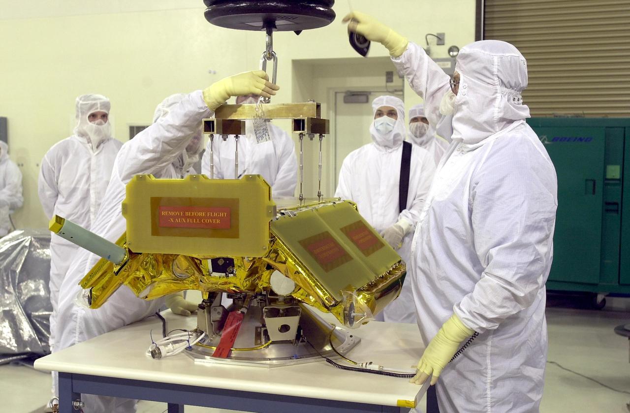 KENNEDY SPACE CENTER, FLA. - The Cosmic Hot Interstellar Plasma Spectrometer, or CHIPSat, undergoes final processing before launch. CHIPSat, a suitcase-size 131-pound satellite, will provide invaluable information into the origin, physical processes and properties of the hot gas contained in the interstellar medium. This can provide important clues about the formation and evolution of galaxies since the interstellar medium literally contains the seeds of future stars.  CHIPSat is scheduled for launch, with the Ice, Cloud, and Land Elevation Satellite (ICESat), on a Delta II expendable launch vehicle from Vandenberg Air Force Base, Calif., on Jan. 11, 2003, between 4:45 p.m. - 5:30 p.m. PST. 