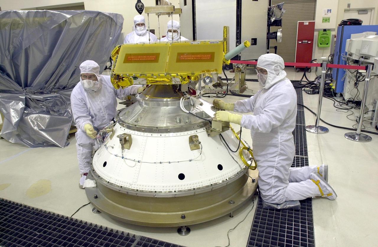 KENNEDY SPACE CENTER, FLA. - The Cosmic Hot Interstellar Plasma Spectrometer, or CHIPSat, undergoes final processing before launch. CHIPSat, a suitcase-size 131-pound satellite, will provide invaluable information into the origin, physical processes and properties of the hot gas contained in the interstellar medium. This can provide important clues about the formation and evolution of galaxies since the interstellar medium literally contains the seeds of future stars.  CHIPSat is scheduled for launch, with the Ice, Cloud, and Land Elevation Satellite (ICESat), on a Delta II expendable launch vehicle from Vandenberg Air Force Base, Calif., on Jan. 11, 2003, between 4:45 p.m. - 5:30 p.m. PST. 