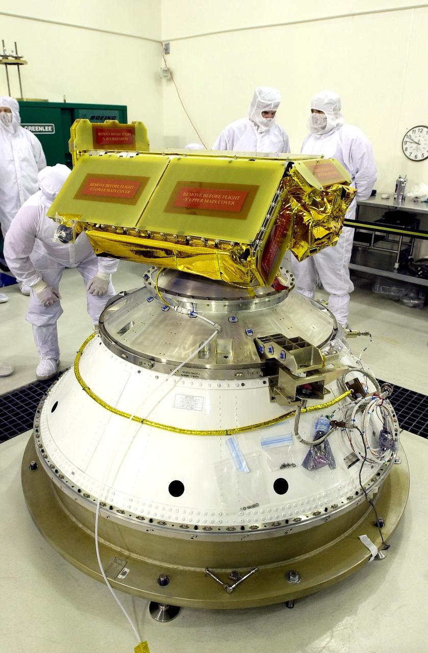 KENNEDY SPACE CENTER, FLA. - The Cosmic Hot Interstellar Plasma Spectrometer, or CHIPSat, undergoes final processing before launch. CHIPSat, a suitcase-size 131-pound satellite, will provide invaluable information into the origin, physical processes and properties of the hot gas contained in the interstellar medium. This can provide important clues about the formation and evolution of galaxies since the interstellar medium literally contains the seeds of future stars.  CHIPSat is scheduled for launch, with the Ice, Cloud, and Land Elevation Satellite (ICESat), on a Delta II expendable launch vehicle from Vandenberg Air Force Base, Calif., on Jan. 11, 2003, between 4:45 p.m. - 5:30 p.m. PST. 