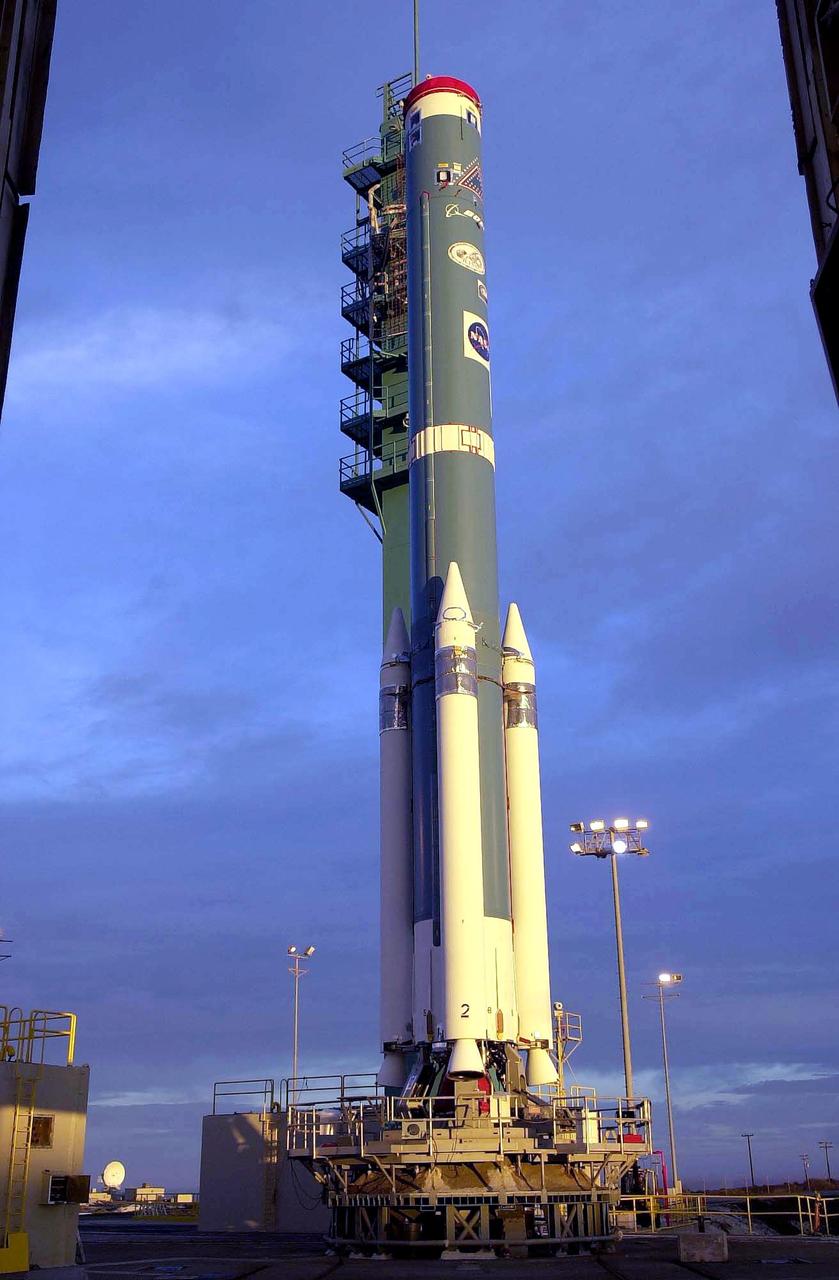 KENNEDY SPACE CENTER, FLA. - At NASA's Space Launch Complex 2 (SLC-2), Vandenberg Air Force Base, Calif., the launch tower has been rolled back to reveal a Delta II rocket with its solid rocket boosters attached. The rocket will carry the ICESat and CHIPSat satellites into Earth orbits. The Ice, Cloud, and Land Elevation Satellite, or ICESat, is a 661-pound satellite known as Geoscience Laser Altimeter System (GLAS) that will revolutionize our understanding of ice and its role in global climate change and how we protect and understand our home planet. It will help scientists determine if the global sea level is rising or falling. It will look at the ice sheets that blanket the Earth's poles to see if they are growing or shrinking. It will assist in developing an understanding of how changes in the Earth's atmosphere and climate effect polar ice masses and global sea level. The Cosmic Hot Interstellar Plasma Spectrometer, or CHIPSat, a suitcase-size 131-pound satellite, will provide invaluable information into the origin, physical processes and properties of the hot gas contained in the interstellar medium. This can provide important clues about the formation and evolution of galaxies since the interstellar medium literally contains the seeds of future stars. The Delta II launch is scheduled for Jan. 11, 2003, between 4:45 p.m. - 5:30 p.m. PST.