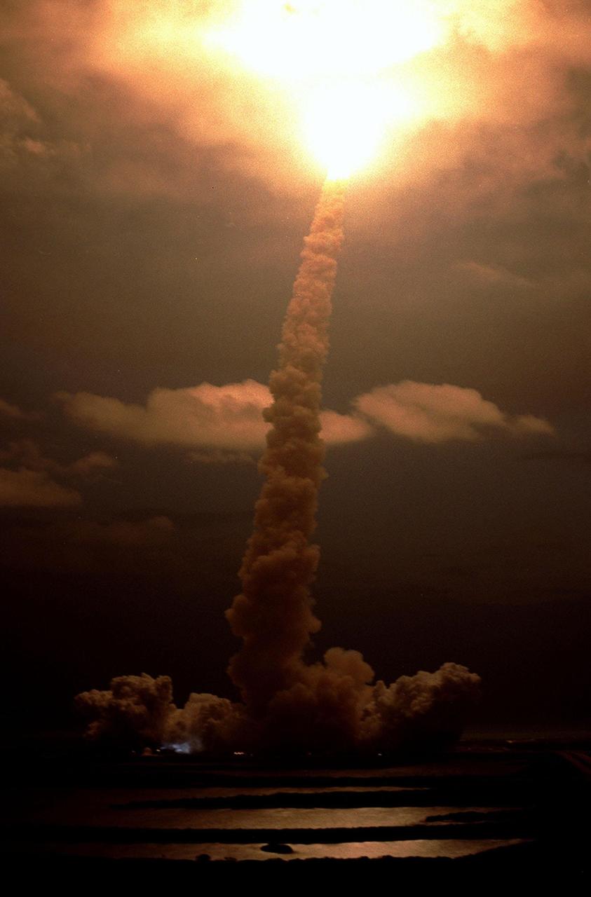 KENNEDY SPACE CENTER, Fla. - The smoke plume identifies the direction of Space Shuttle Columbia as it climbs into the clouds, illuminated by the Shuttle's exhaust, after launch on mission STS-109.  Liftoff occurred at 6:22:02:08 a.m. EST (11:22:02:08 GMT). This was the 27th flight of the vehicle and 108th in the history of the Shuttle program.  The goal of mission STS-109 is the maintenance and upgrade of the Hubble Space Telescope, to be carried out in five spacewalks.  The crew comprises Commander Scott D. Altman, Pilot Duane G. Carey, Payload Commander John M. Grunsfeld, and Mission Specialists Nancy Jane Currie, Richard M. Linnehan, James H. Newman and Michael J. Massimino.  After the 11-day mission, Columbia is expected to return to KSC March 12 about 4:35 a.m. EST (09:35 GMT). 