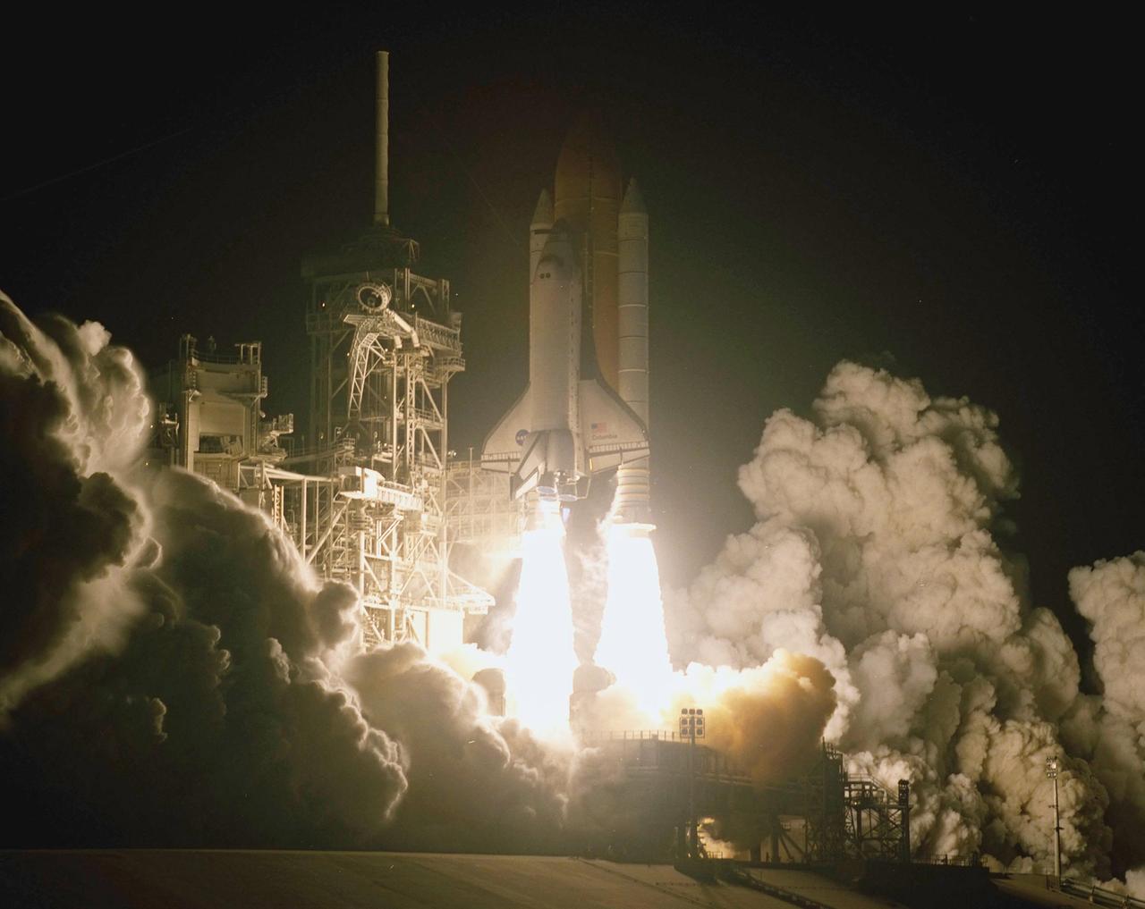 KENNEDY SPACE CENTER, Fla.  - Billows of smoke and steam flow over the launch pad as Space Shuttle Columbia leaps into space on mission STS-109.  Liftoff occurred at 6:22:02:08 a.m. EST (11:22:02:08 GMT). This was the 27th flight of the vehicle and 108th in the history of the Shuttle program.  The goal of mission STS-109 is the maintenance and upgrade of the Hubble Space Telescope, to be carried out in five spacewalks.  The crew comprises Commander Scott D. Altman, Pilot Duane G. Carey, Payload Commander John M. Grunsfeld, and Mission Specialists Nancy Jane Currie, Richard M. Linnehan, James H. Newman and Michael J. Massimino.  After the 11-day mission, Columbia is expected to return to KSC March 12 about 4:35 a.m. EST (09:35 GMT). 
