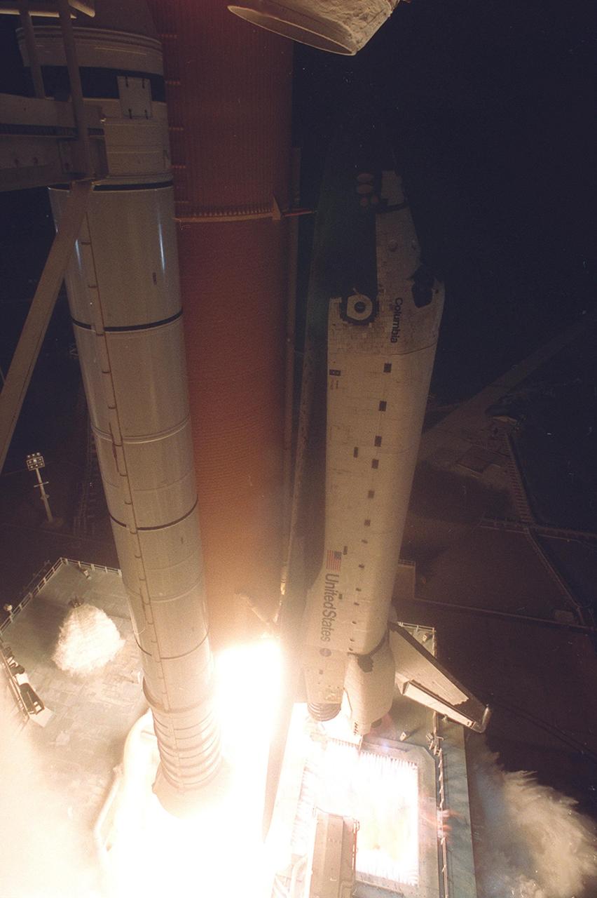 KENNEDY SPACE CENTER, Fla. -  At liftoff of Space Shuttle Columbia, a torrent of water begins to flow from rainbirds (at bottom left and right) onto the Mobile Launcher Platform to help with sound suppression.  Acoustical levels reach their peak when the Space Shuttle is about 300 feet above the MLP.  There are six 12-foot rainbirds mounted on the MLP.  Liftoff of Columbia on mission STS-109 occurred at 6:22:02:08 a.m. EST (11:22:02:08 GMT). This was the 27th flight of the vehicle and 108th in the history of the Shuttle program.  The goal of the mission is the maintenance and upgrade of the Hubble Space Telescope, to be carried out in five spacewalks.  The crew comprises Commander Scott D. Altman, Pilot Duane G. Carey, Payload Commander John M. Grunsfeld, and Mission Specialists Nancy Jane Currie, Richard M. Linnehan, James H. Newman and Michael J. Massimino.  After the 11-day mission, Columbia is expected to return to KSC March 12 about 4:35 a.m. EST (09:35 GMT)