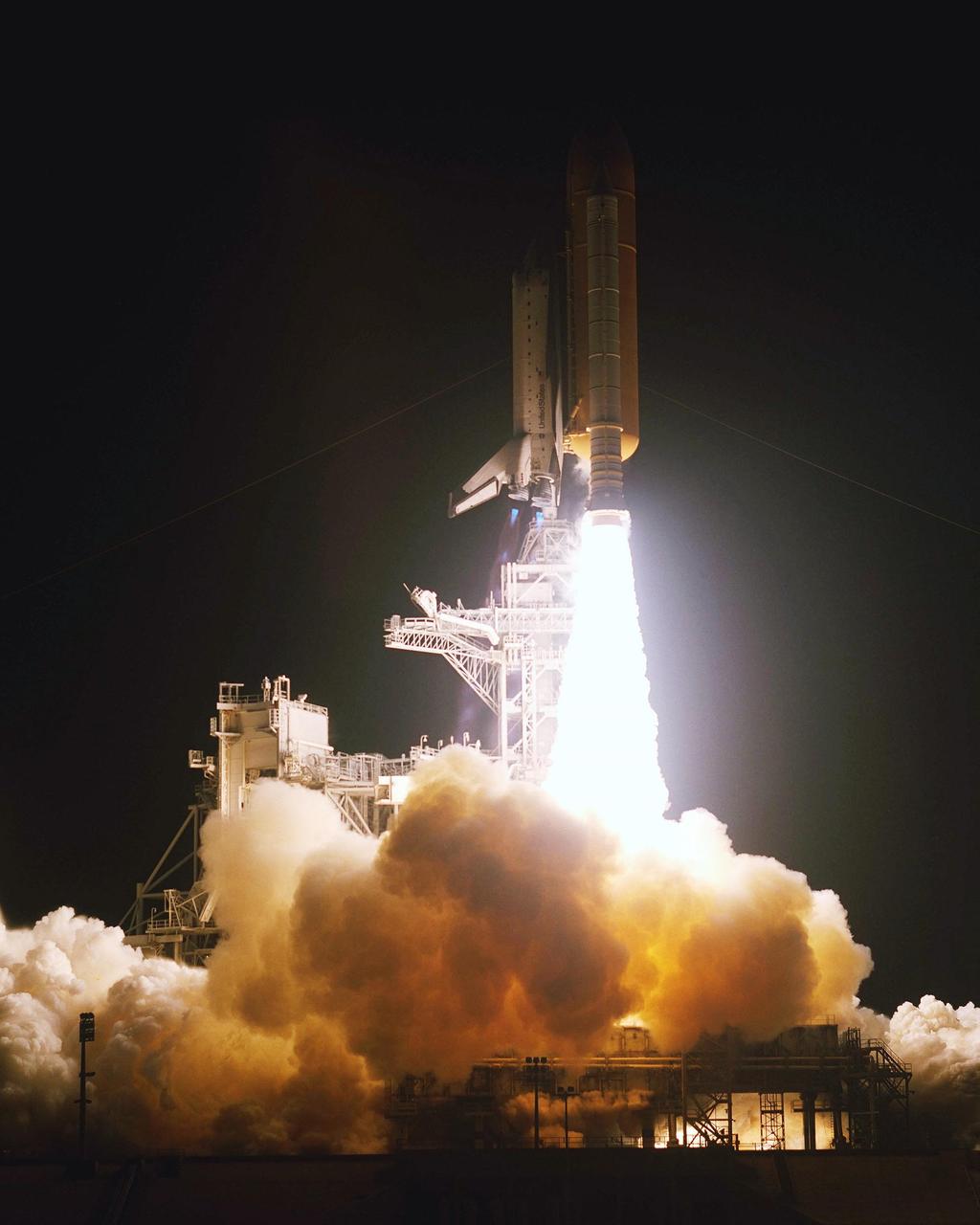 KENNEDY SPACE CENTER, Fla. - Space Shuttle Columbia hurtles into space above a fiery trail of flames that illuminate the clouds of smoke and steam below.  Liftoff of Columbia occurred at 6:22:02:08 a.m. EST (11:22:02:08 GMT). This was the 27th flight of the vehicle and 108th in the history of the Shuttle program.  The goal of the mission is the maintenance and upgrade of the Hubble Space Telescope, to be carried out in five spacewalks.  The crew comprises Commander Scott D. Altman, Pilot Duane G. Carey, Payload Commander John M. Grunsfeld, and Mission Specialists Nancy Jane Currie, Richard M. Linnehan, James H. Newman and Michael J. Massimino.  After the 11-day mission, Columbia is expected to return to KSC March 12 about 4:35 a.m. EST (09:35 GMT)