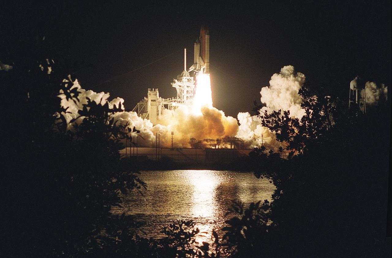 KENNEDY SPACE CENTER, Fla. - Trees and shrubs are silhouetted on the near bank by the brilliant exhaust of Space Shuttle Columbia as it hurtles into the pre-dawn sky on mission STS-109.  Liftoff of Columbia occurred at 6:22:02:08 a.m. EST (11:22:02:08 GMT). This was the 27th flight of the vehicle and 108th in the history of the Shuttle program.  The goal of the mission is the maintenance and upgrade of the Hubble Space Telescope, to be carried out in five spacewalks.  The crew comprises Commander Scott D. Altman, Pilot Duane G. Carey, Payload Commander John M. Grunsfeld, and Mission Specialists Nancy Jane Currie, Richard M. Linnehan, James H. Newman and Michael J. Massimino.  After the 11-day mission, Columbia is expected to return to KSC March 12 about 4:35 a.m. EST (09:35 GMT)