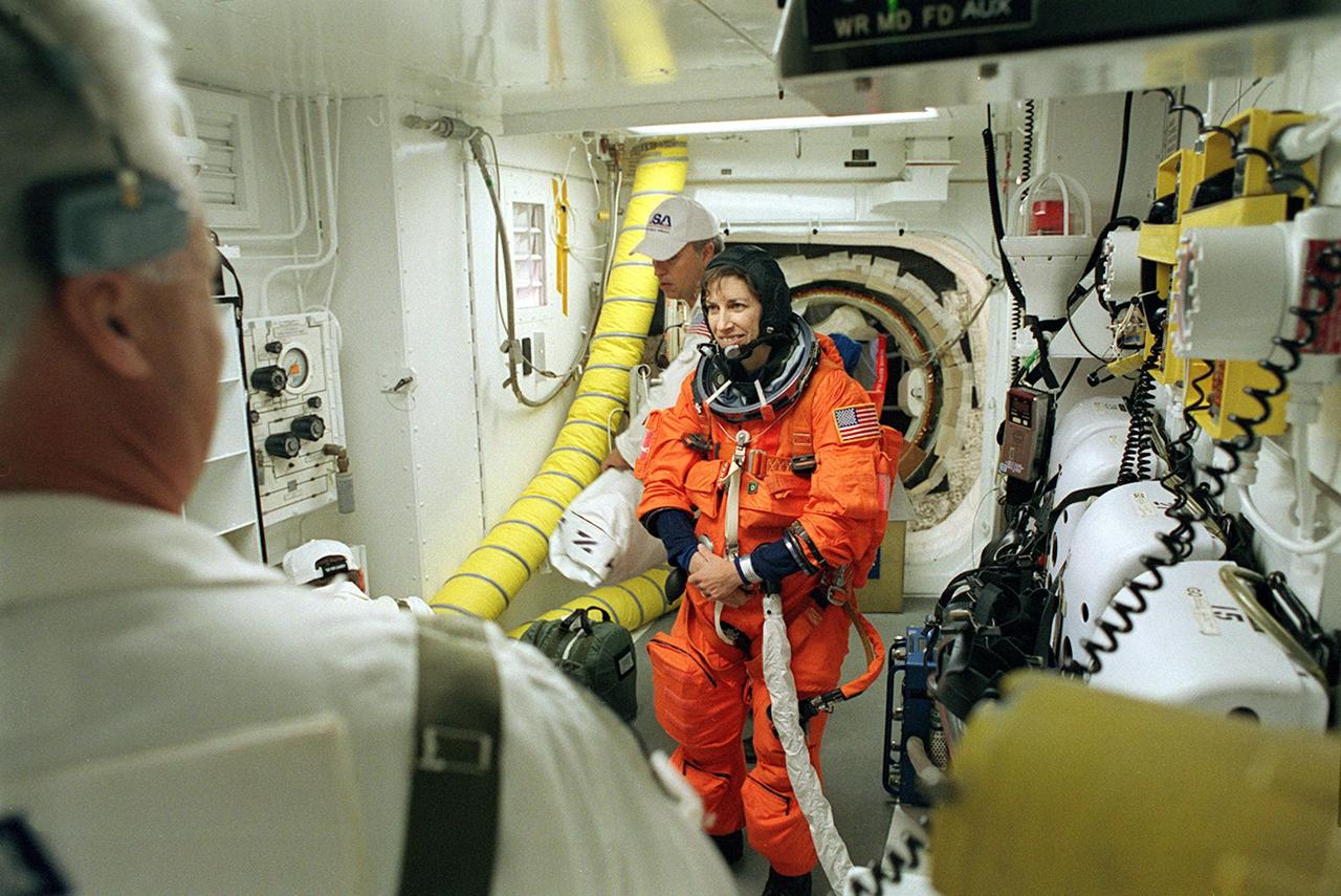 KENNEDY SPACE CENTER, FLA. -- STS-110 Mission Specialist Ellen Ochoa has final suit preparations - In the White Room before entering Space Shuttle Atlantis for launch. The White Room provides entry into the cockpit area of the orbiter. This is Ochoa's fourth Shuttle flight. On this 13th assembly flight to the International Space Station, STS-110 is carrying the S0 Integrated Truss Structure and Mobile Transporter (MT). During the 11-day mission, astronauts will make four spacewalks to attach the S0 truss, which will become the backbone of the Space Station, to the U.S. Lab, "Destiny." The MT, a space "railcar," is attached to the truss segment and will make its debut run during the flight. Launch is scheduled for 4:40 p.m. EDT (20:40 GMT).