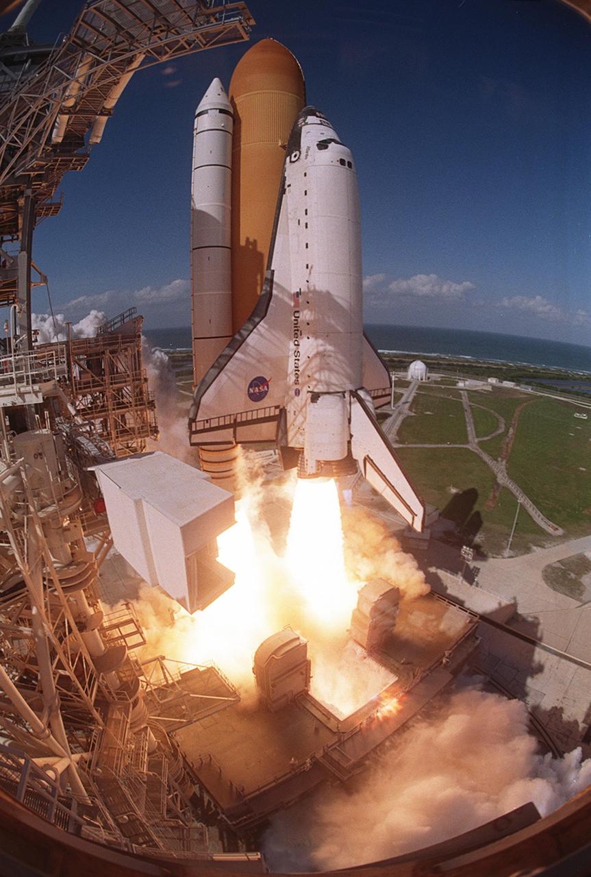 KENNEDY SPACE CENTER, FLA. - A fish eye view captures the liftoff of Space Shuttle Atlantis from Launch Pad 39B.  At left is the Fixed Service Structure and below the Shuttle is the Mobile Launcher Platform.  In the background is the Atlantic Ocean. Liftoff of Atlantis on mission STS-110 occurred at 4:44:19 p.m. EDT (20:41:19 GMT).  Carrying the S0 Integrated Truss Structure and Mobile Transporter, STS-110 is the 13th assembly flight to the International Space Station