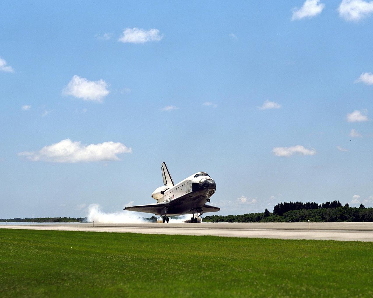 KENNEDY SPACE CENTER, FLA. - Atlantis and crew return to Earth, touching down on the KSC Shuttle Landing Facility runway 33, after completing the 10-day, 19-hour, 4.5-million mile mission STS-110 to the International Space Station.   The crew comprises Commander Michael Bloomfield, Pilot Stephen Frick and Mission Specialists Jerry Ross, Steven Smith, Ellen Ochoa, Lee Morin and Rex Walheim.  Main gear touchdown was 12:26:57 p.m. EDT, nose gear touchdown was 12:27:09 p.m. and wheel stop was 12:28:07 p.m.  The crew delivered and installed the S0 truss, which will support cooling and power systems essential for the addition of future international laboratories, on the Station
