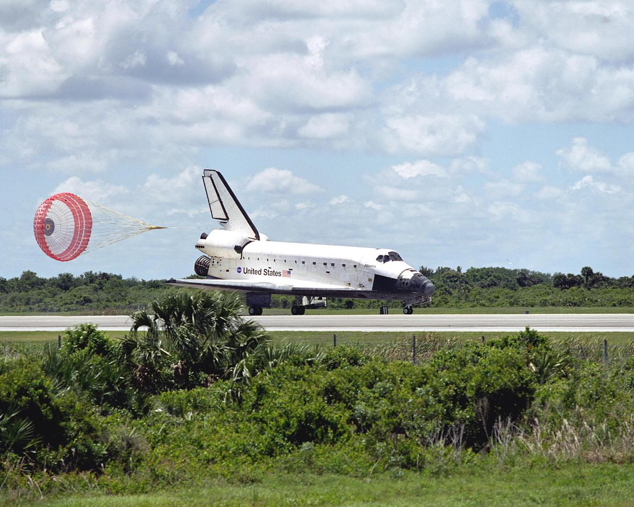 KENNEDY SPACE CENTER, FLA. --  Atlantis lands at the KSC Shuttle Landing Facility, runway 33, after completing the 10-day, 19-hour, 4.5-million mile mission STS-110 to the International Space Station.   The orbiter carries the crew of seven:  Commander Michael Bloomfield, Pilot Stephen Frick and Mission Specialists Jerry Ross, Steven Smith, Ellen Ochoa, Lee Morin and Rex Walheim.  Main gear touchdown was 12:26:57 p.m. EDT, nose gear touchdown was 12:27:09 p.m. and wheel stop was 12:28:07 p.m.  The crew delivered and installed the S0 truss, which will support cooling and power systems essential for the addition of future international laboratories, on the Station