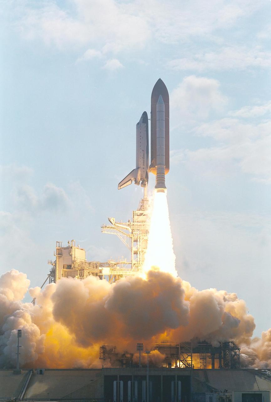 KENNEDY SPACE CENTER, FLA. -  With clouds of smoke and steam rolling below, Space Shuttle Endeavour rises above them as it roars toward space on mission STS-111 to the International Space Station.  Liftoff occurred at 5:22:49 p.m. EDT. The STS-111 crew includes Commander Kenneth Cockrell, Pilot Paul Lockhart, and Mission Specialists Franklin Chang-Diaz and Philippe Perrin (CNES), as well as the Expedition Five crew members Valeri Korzun, Peggy Whitson and Sergei Treschev.  This mission marks the 14th Shuttle flight to the International Space Station and the third Shuttle mission this year. Mission STS-111 is the 18th flight of Endeavour and the 110th flight overall in NASA's Space Shuttle program