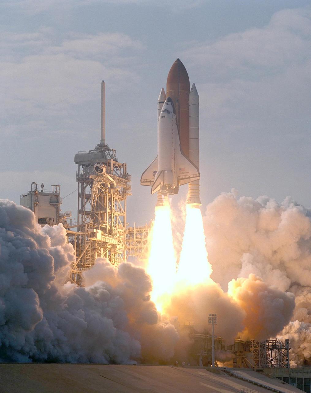 KENNEDY SPACE CENTER, FLA. -- Twin columns of fire trail Space Shuttle Endeavour as it roars toward space on mission STS-111 to the International Space Station. Liftoff occurred at 5:22:49 p.m. EDT. The STS-111 crew includes Commander Kenneth Cockrell, Pilot Paul Lockhart, and Mission Specialists Franklin Chang-Diaz and Philippe Perrin (CNES), as well as the Expedition Five crew members Valeri Korzun, Peggy Whitson and Sergei Treschev. This mission marks the 14th Shuttle flight to the International Space Station and the third Shuttle mission this year. Mission STS-111 is the 18th flight of Endeavour and the 110th flight overall in NASA's Space Shuttle program