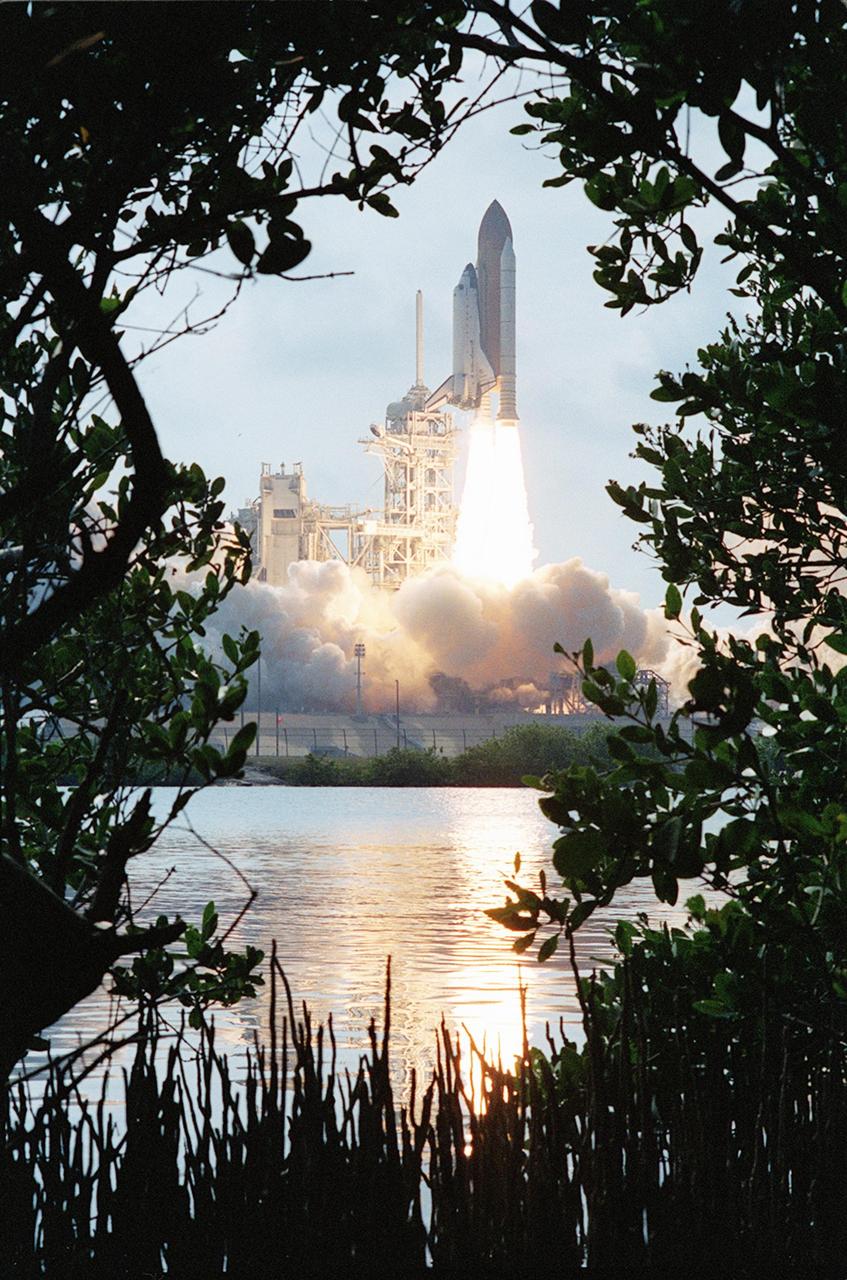 KENNEDY SPACE CENTER, FLA. -- Water near Launch Pad 39A reflects the fiery trail behind Space Shuttle Endeavour as it lifts off on mission STS-111. Liftoff occurred at 5:22:49 p.m. EDT. This mission marks the 14th Shuttle flight to the International Space Station and the third Shuttle mission this year. Mission STS-111 is the 18th flight of Endeavour and the 110th flight overall in NASA's Space Shuttle program