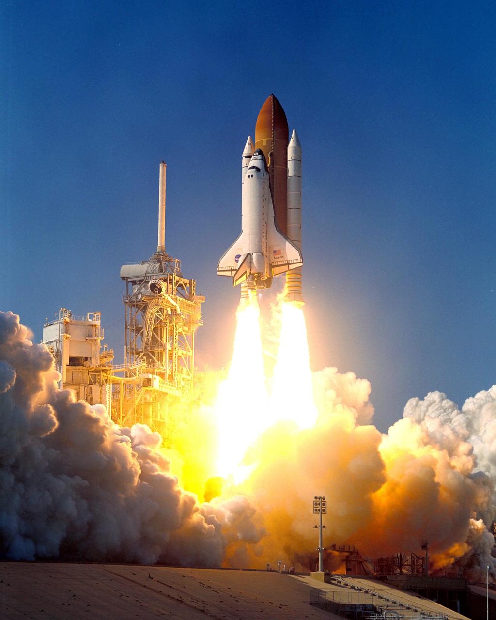KENNEDY SPACE CENTER, FLA. - -- Space Shuttle Atlantis roars toward the clear blue sky and space as it begins its journey to the International Space Station (ISS) on mission STS-112. Liftoff occurred on time at 3:46 p.m. EDT. Along with a crew of six, Atlantis carries the S1 Integrated Truss Structure and the Crew and Equipment Translation Aid (CETA) Cart A to the Space Station. The CETA is the first of two human-powered carts that will ride along the ISS railway, providing mobile work platforms for future spacewalking astronauts. On the 11-day mission, three spacewalks are planned to attach the S1 truss.